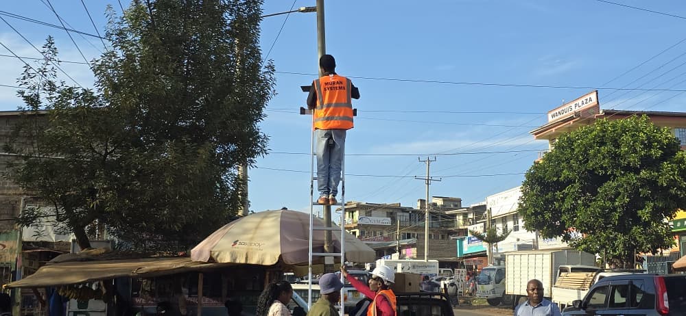 Muran Systems technician mounting an air quality sensor on a metal frame